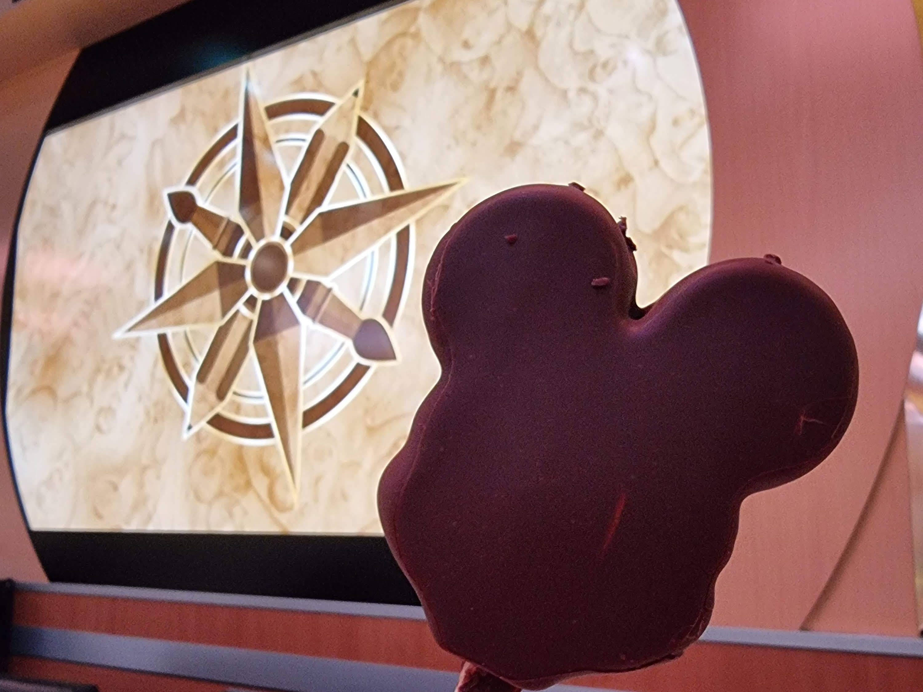 A Mickey bar, in front of Animator's Palate decor.