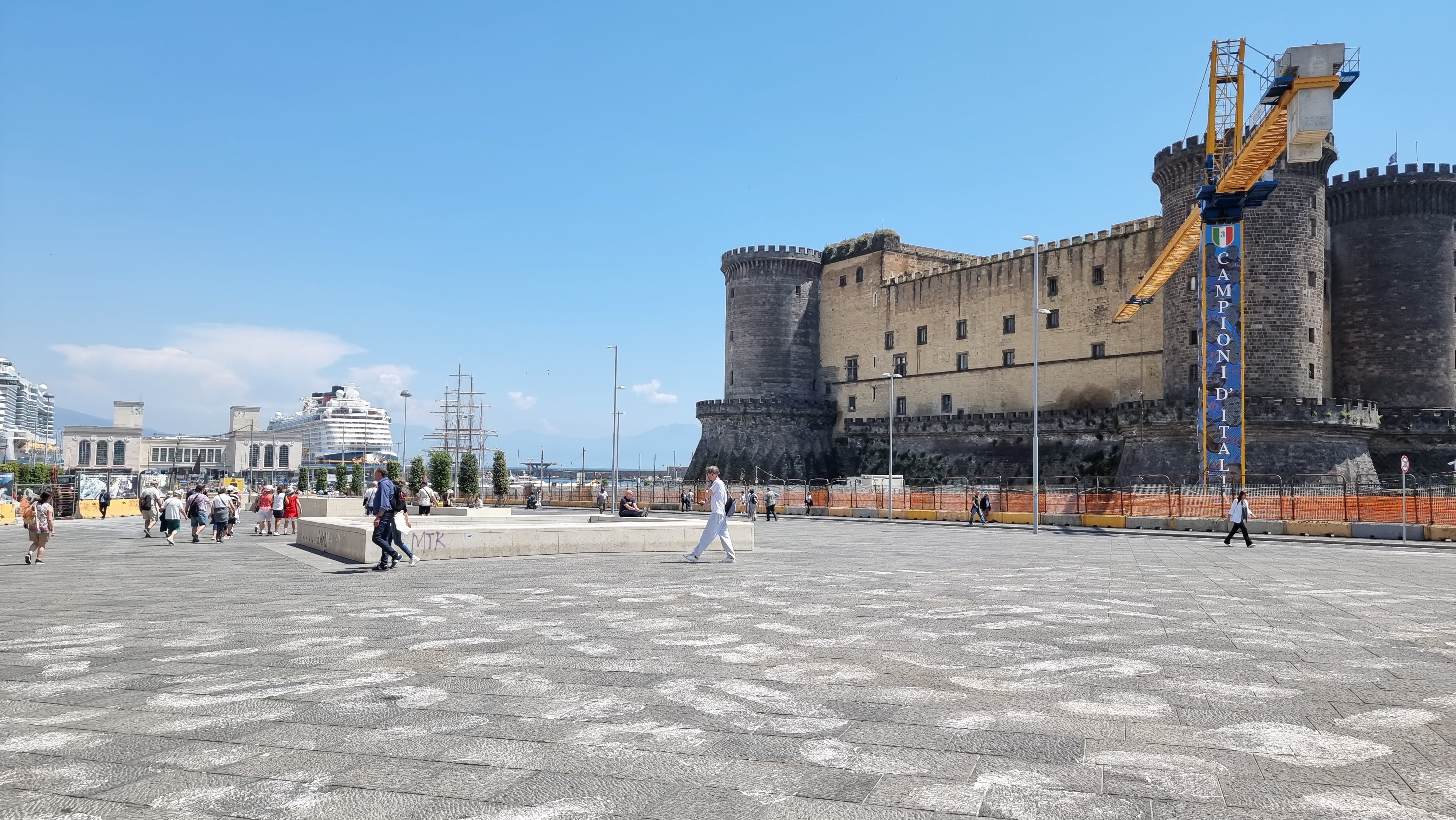 View of the Disney Dream docked in Naples, beside Castel Nuovo