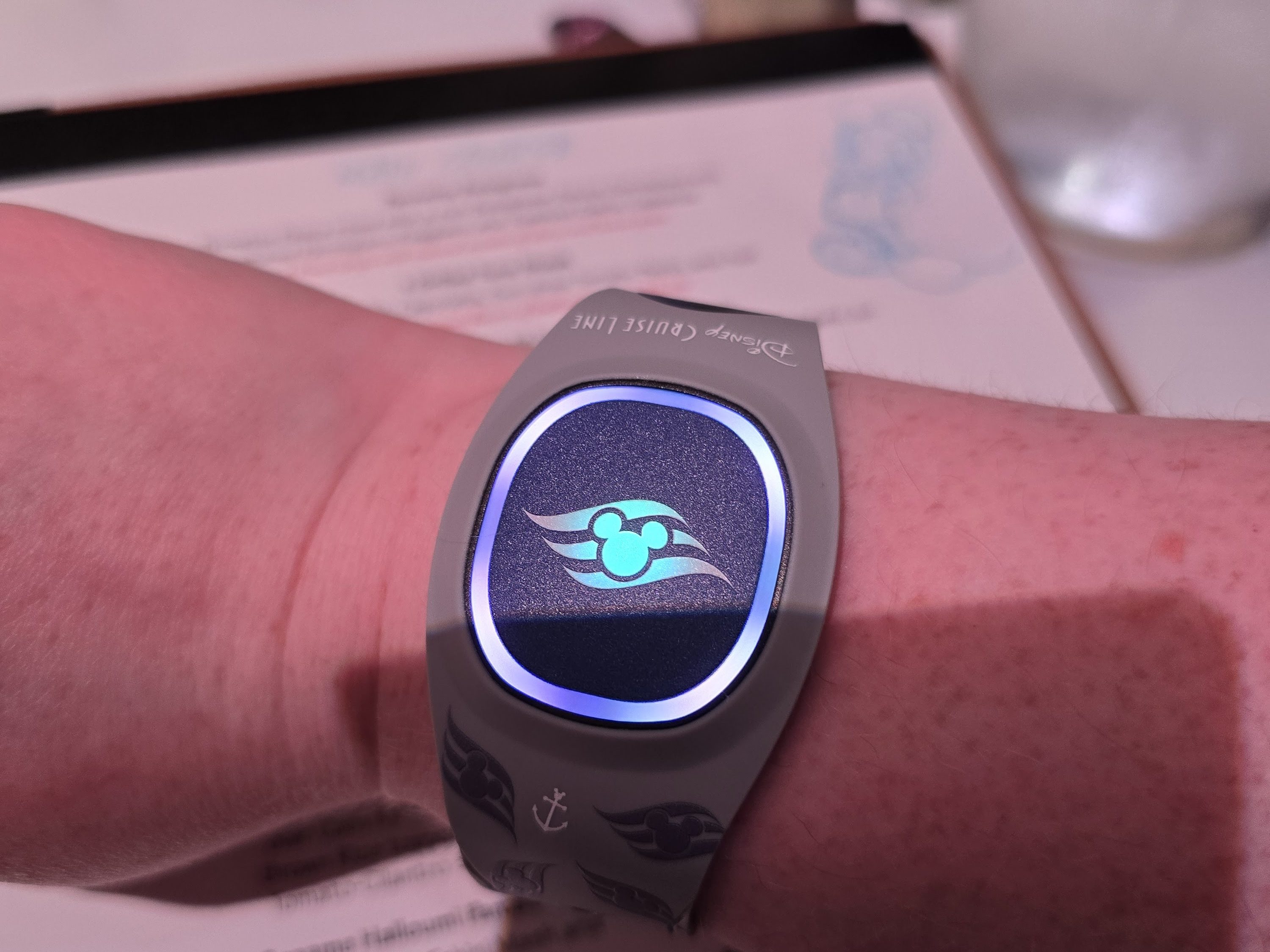 DisneyBand+ lights up during the show in Animator's Palate