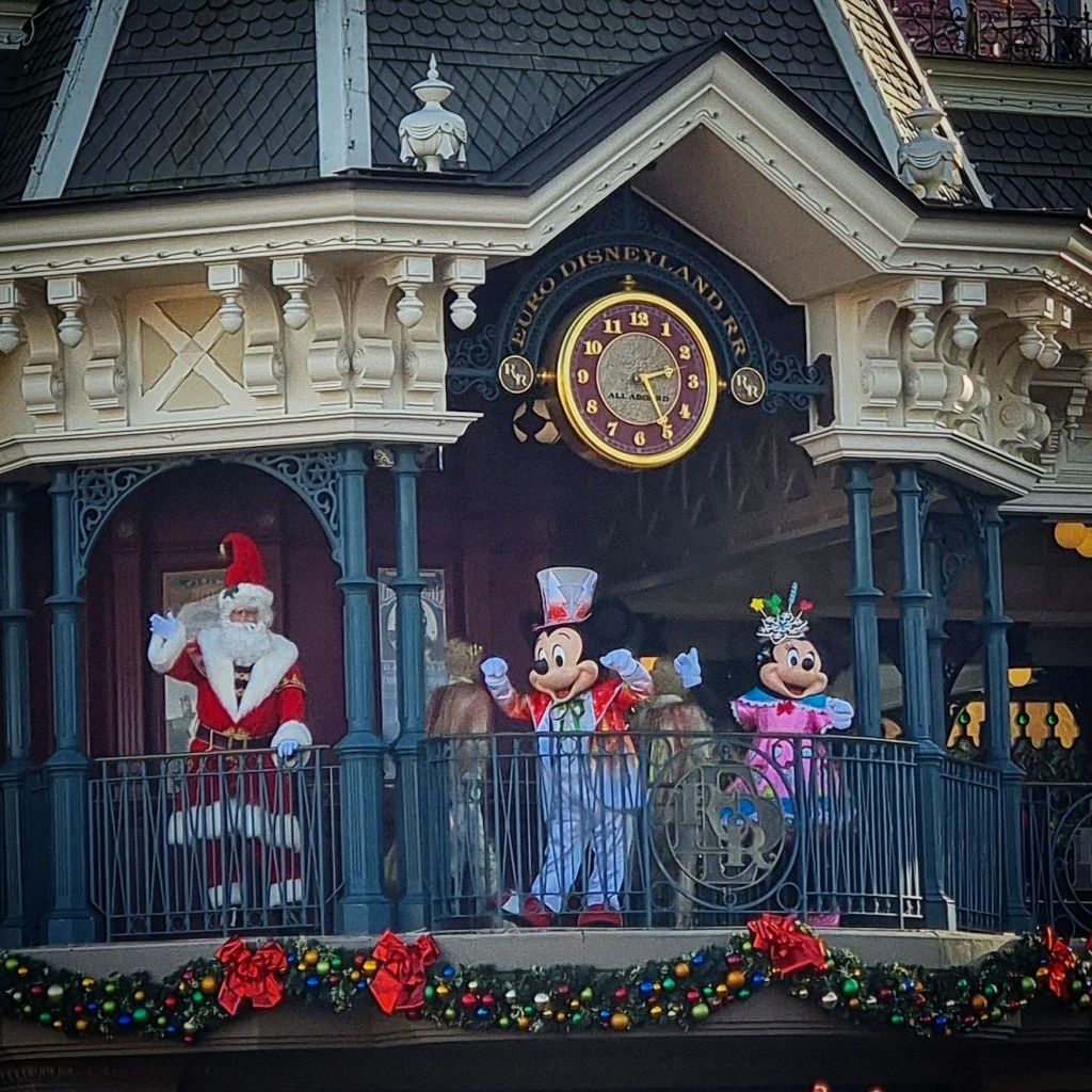 Santa with Mickey and Minnie at the Main Street, USA train station at Disneyland Paris.