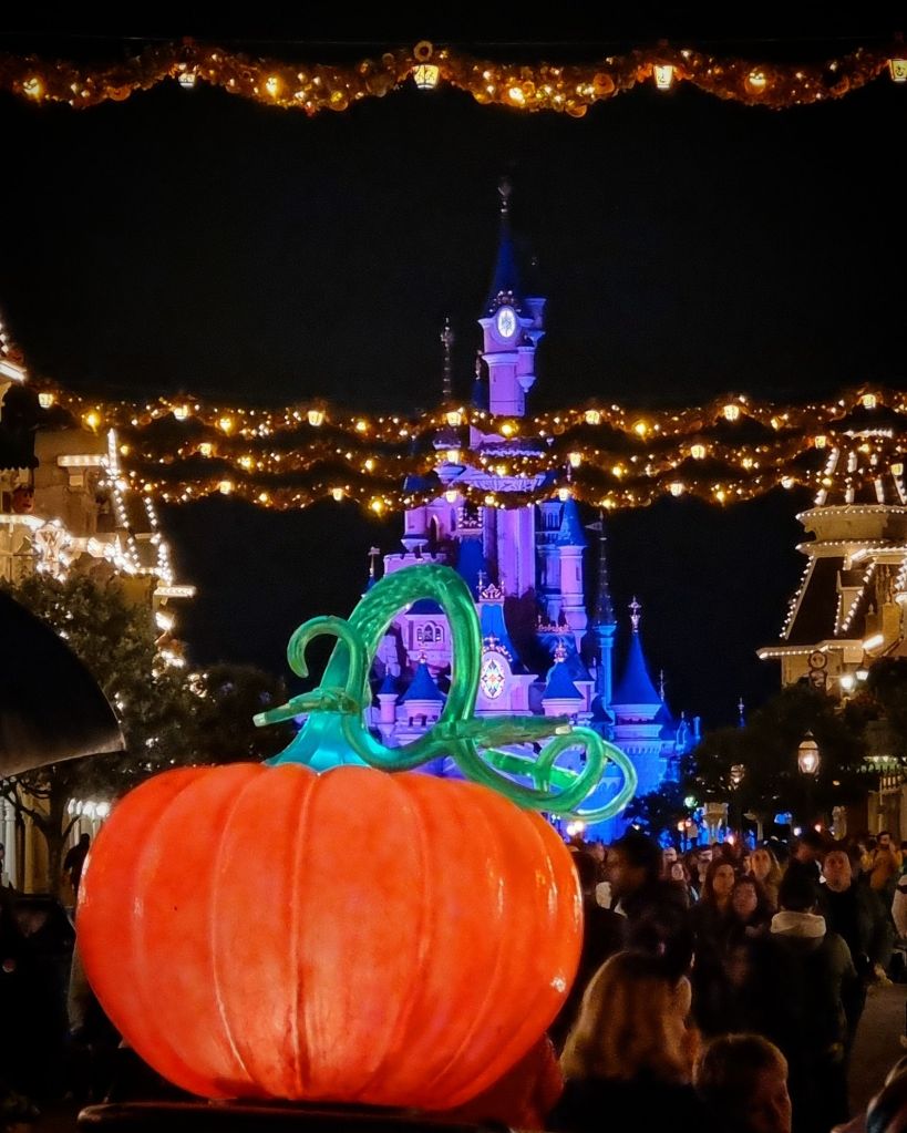 Le Château de la Belle au Bois Dormant, behind the Hallowe'en garlands on Main Street, USA.